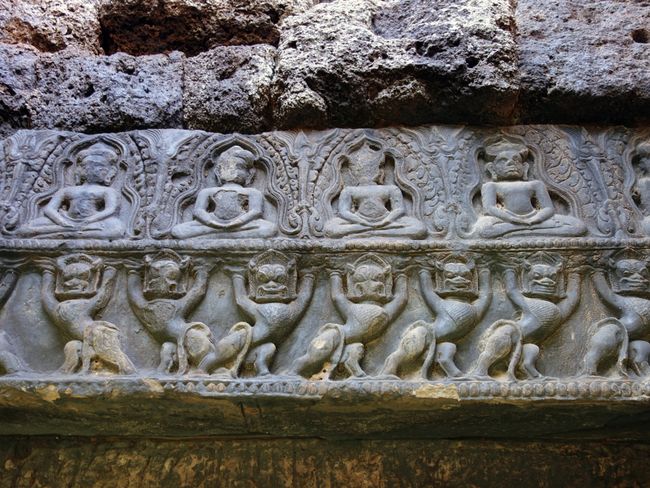 Meditating yogis and wild lions on a lintel in Phimai