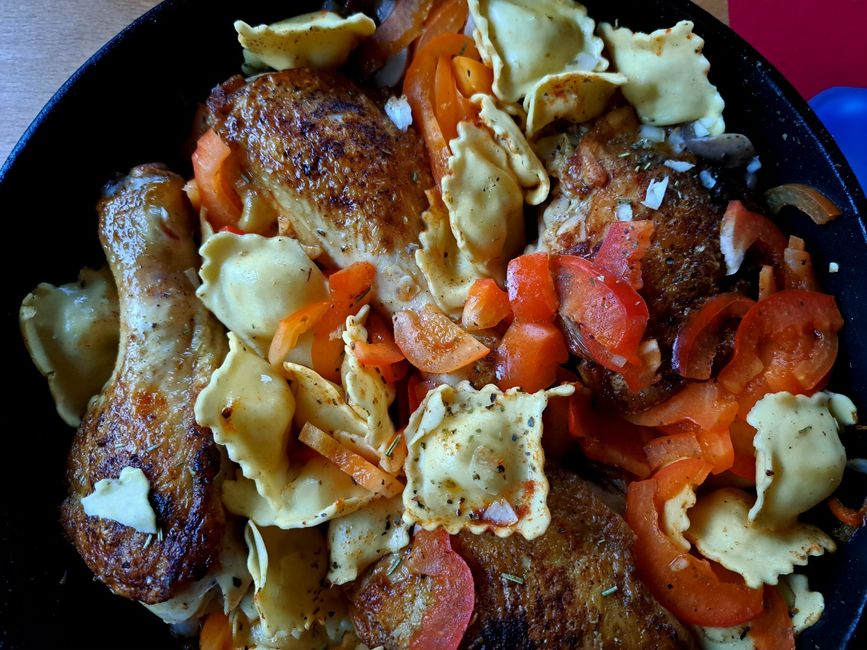 Crispy fried leg of tender Bresse chicken in a fruity bed of peppers, tomatoes, garlic and herbs on tasty tortellini with a delicately melting parmesan and ricotta filling