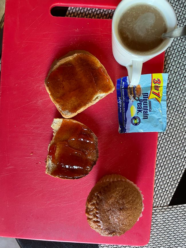 Breakfast for winners: instant coffee, jam toast, and blueberry muffin