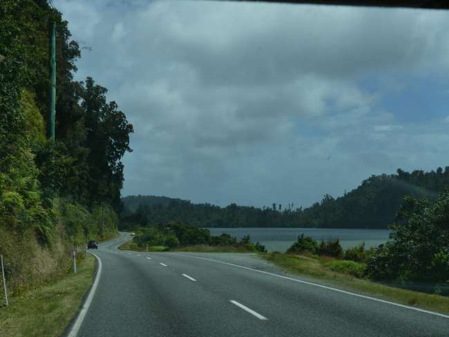 Drive through a green lake landscape