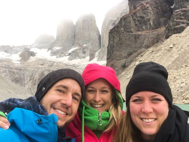summit-climbing trio selfie
