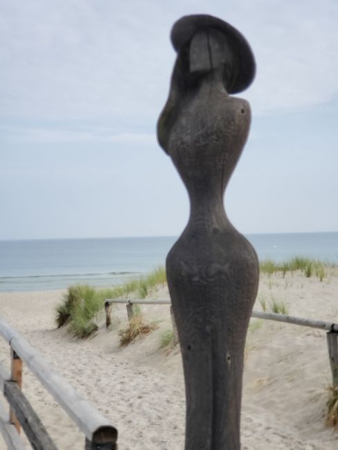 Wooden woman next to it. Art can be so beautiful and simple.