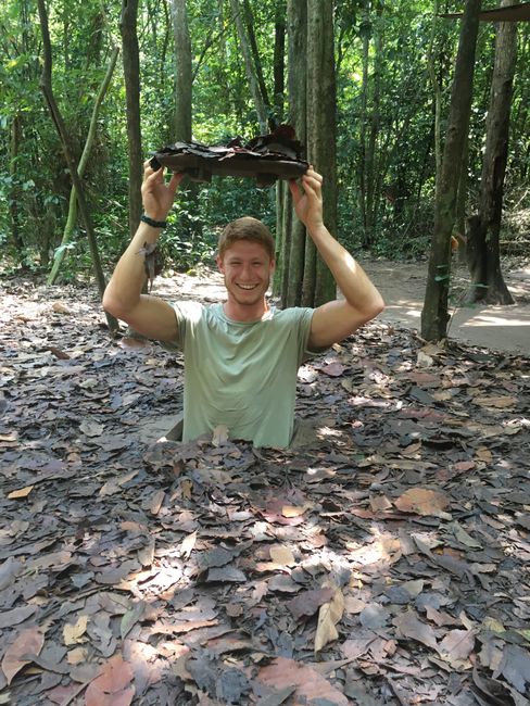Dennis exploring the Cu Chi Tunnels