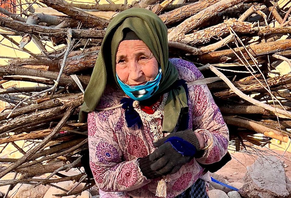 An old Moroccan woman with a heavy burden.