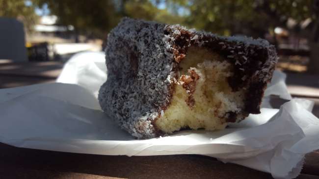 Typical cake here 'Lamington'. Simple sponge cake with chocolate and coconut around it. Super delicious
