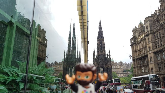The Scott Monument with a slightly distorted reflection