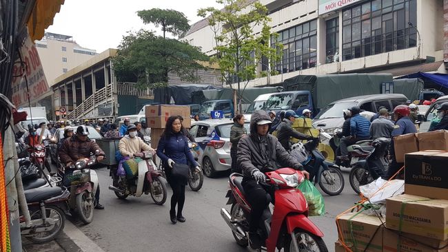 The streets: just chaotic. Sidewalks are blocked with scooters, so we walk on the street. Then thousands of scooters, cars. Traffic rules are not really followed.