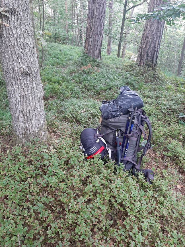 Packed backpack at camping spot