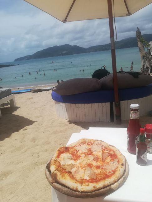 Perfect lazy day at the beach with pizza