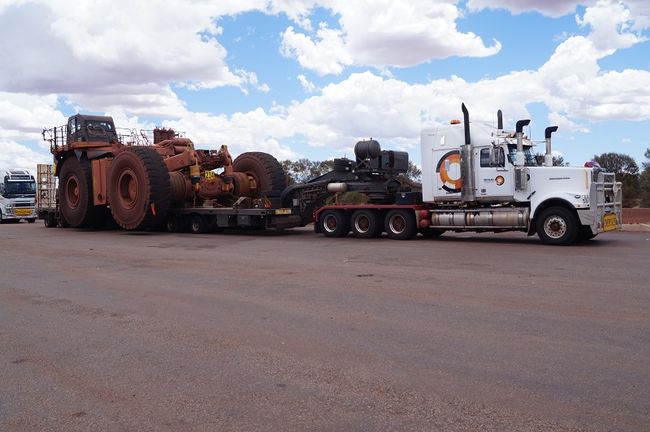 On the way, a road train has loaded tipping parts