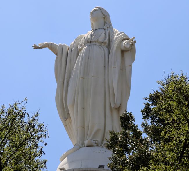 On the summit, a statue of Mary, watching over Santiago