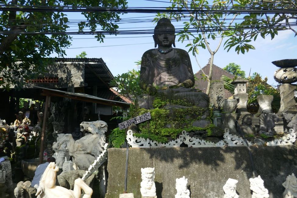Temple figures are offered along the road