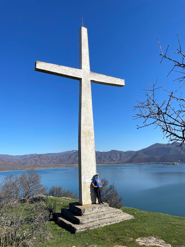 The height of the summit cross is inversely proportional to the height of the hill