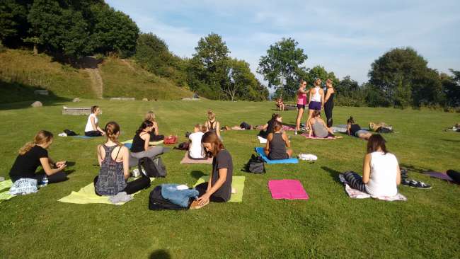 Yoga in the park with a view of the sea