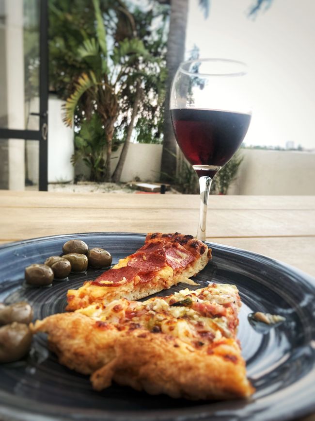 pizza, red wine, and homemade pickled olives