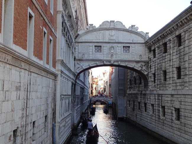 View of the Bridge of Sighs with mass tourism below