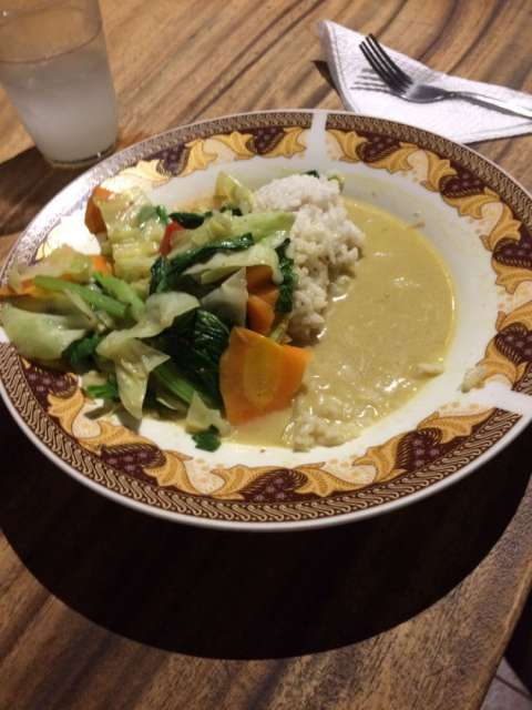 Indonesian breakfast - fried rice with vegetables and chicken