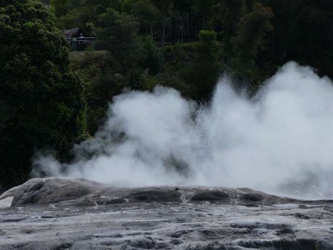 Eruption of a small neighboring geyser