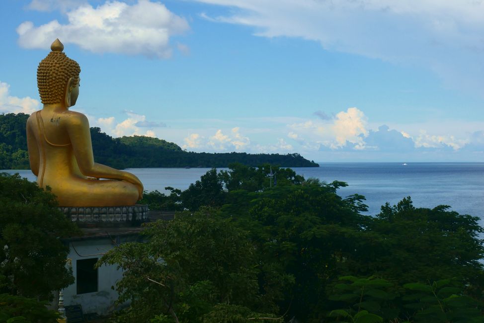 Seated Buddha with sea view