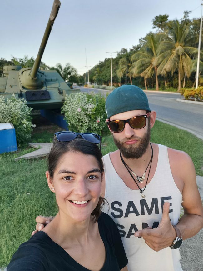 We in front of a tank