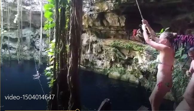 Off we go - swinging across the cenote with the liana