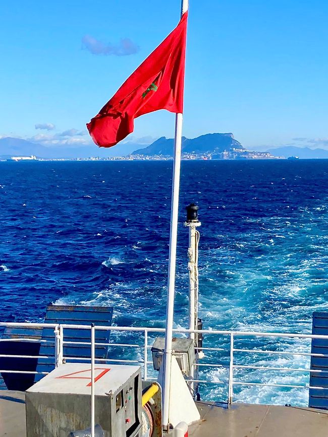 The Moroccan flag fluttering in the wind during the crossing.
