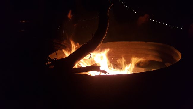 We sat by the fire at the camping spot.