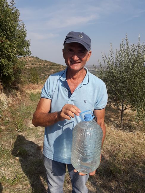 The farmer with the pear, grapes, and water to refresh