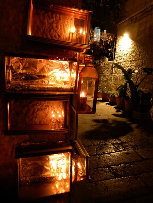 Even in the narrow streets of the Old City, little lights shine in honor of the Hanukkah festival