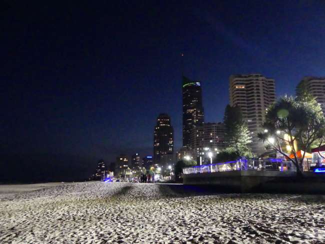 Beach and city at night