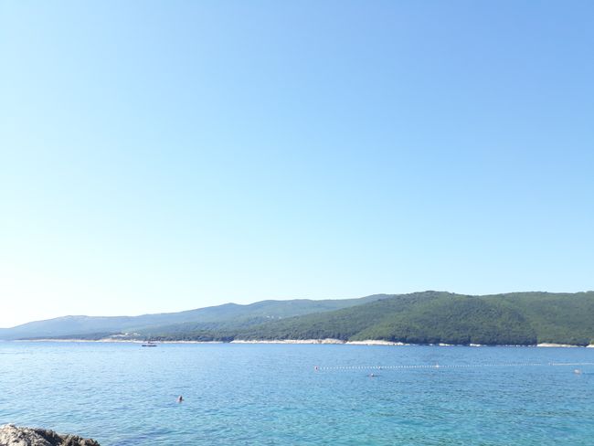 The rocky beach of Rabac. Many fish and many tourists. Good and free parking above the town in a pine forest.