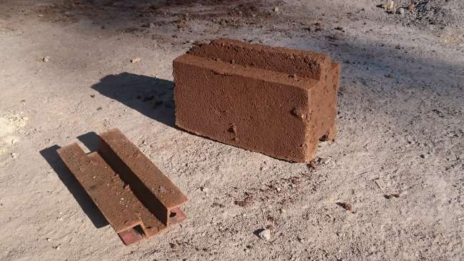 Molded prototype brick and mold insert.