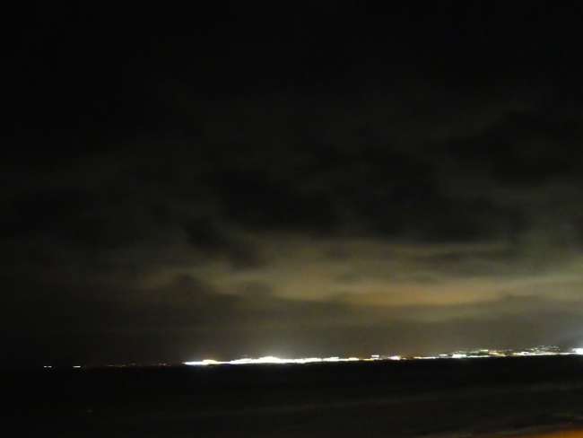 Mainland and illuminated clouds