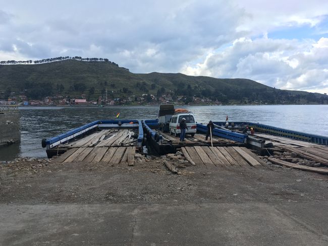 The road from Peru to Bolivia is interrupted by an arm of Lake Titicaca. So we had to switch to a small passenger ferry and for our bus to another separate 'raft'.