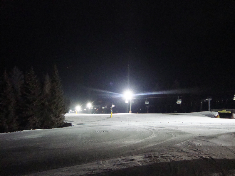 The ski slope of the Haunold ski area at night - Night skiing in Innichen