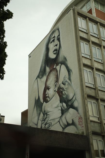 Clothed with the Sun by EL MAC. With the highest rate of teenage pregnancy, the UK also has a high number of single mothers. This is a tribute to them, a very photorealistic image directly above Bluebell Place, a birthing clinic in Bristol. The image was inspired in part by the paintings of the Virgin Mary by Renaissance artists Raphael and Michelangelo.