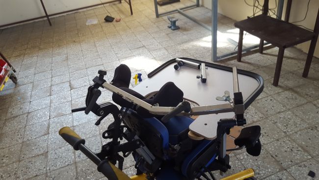 Articulated arm on wheelchair