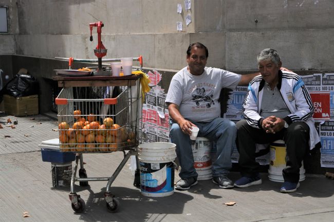 Sellers of freshly squeezed orange juice next to the cathedral