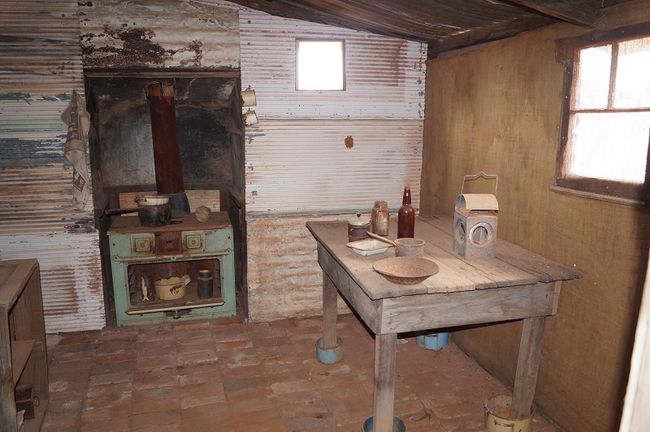 Kitchen in the corrugated iron house, fireplace moved to the outside