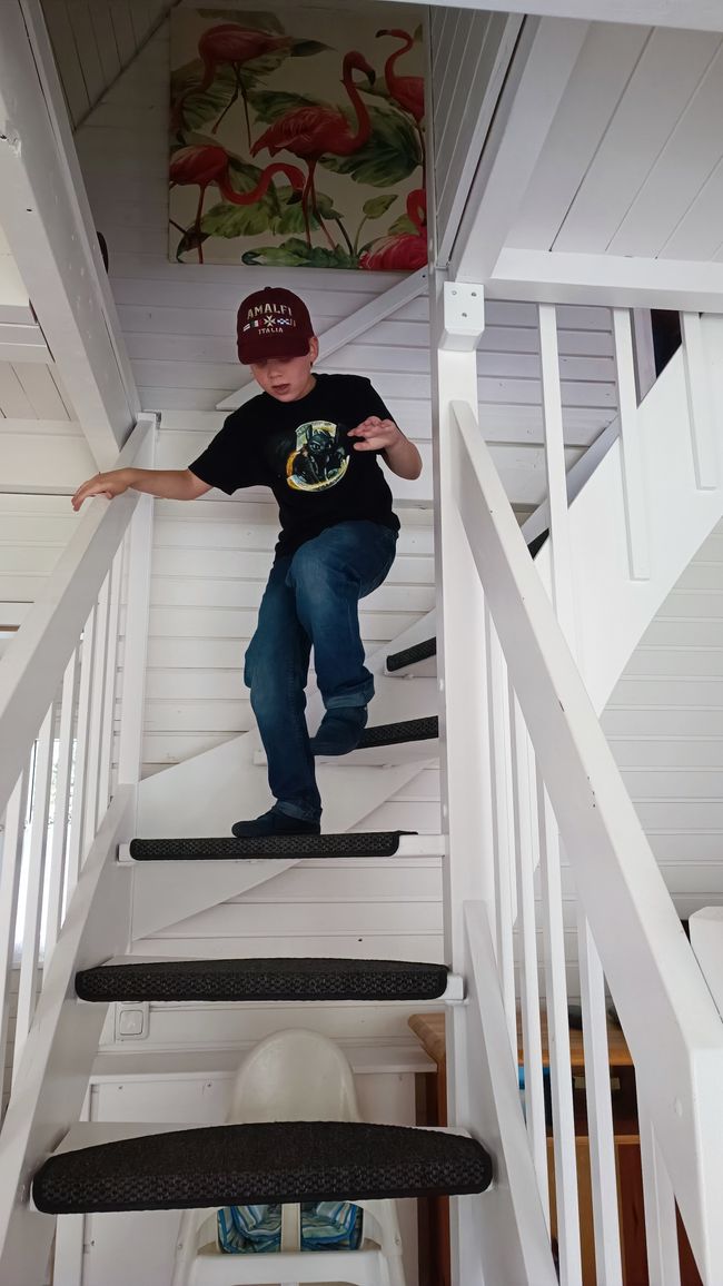 Liam on the stairs in the vacation house