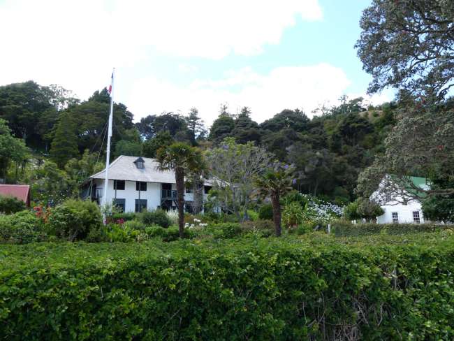 Old villas behind bushes