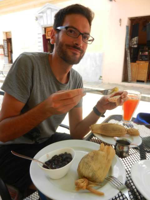 Having breakfast with tamales