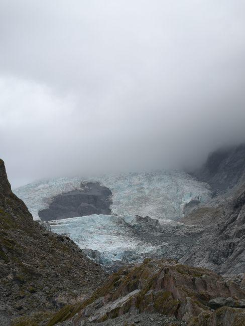 The glacier just peeking out of the clouds