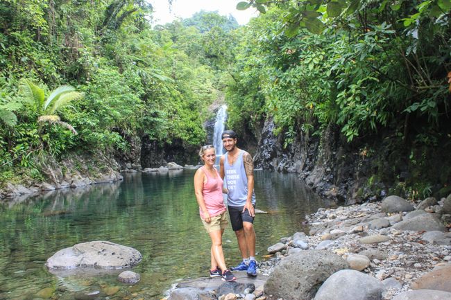 Photo in front of the waterfalls at the end of the Lavena Coastal Walk