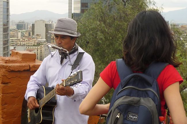 Street musician high above the city