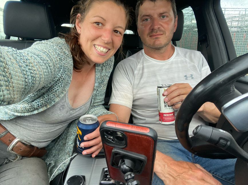 Shelter from the storm in the car with beer