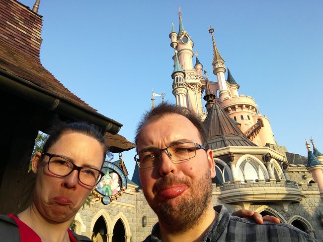 Us in front of the Disney castle