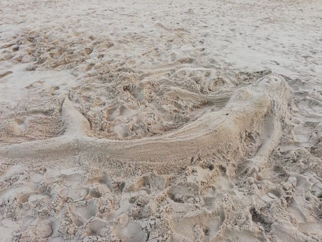 Meerjungfrau im Sand der Virginia Beach
