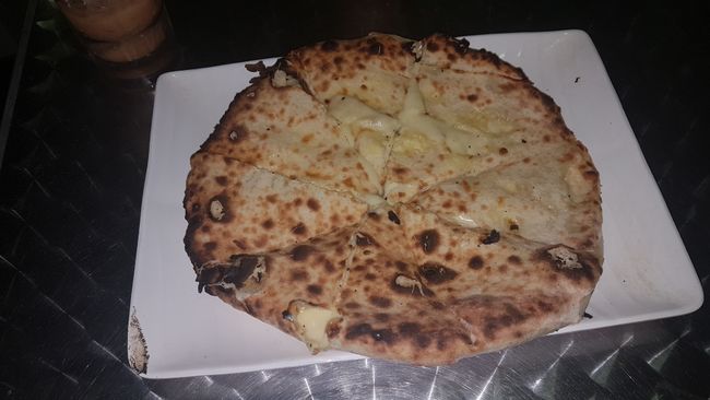 And Cheese Naan (Indian cuisine). I didn't have much appetite due to the fever. I managed to eat half, and the other half was enjoyed by the two other friends of Benedikt who were waiting at the accommodation. Johannes was taken down by the flu and Nik looked after him. 