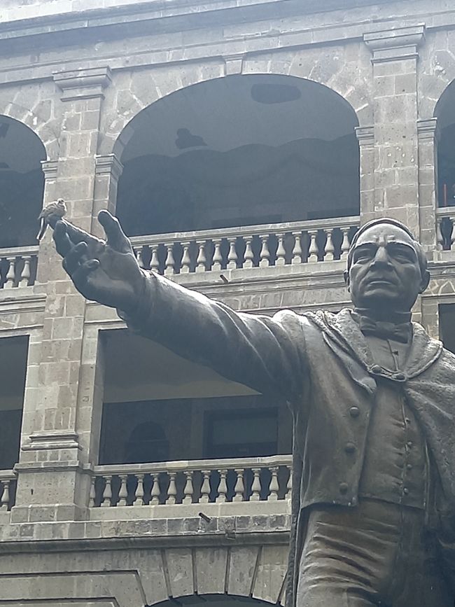Benito Juarez (with a sparrow in his hand) is particularly honored for the introduction of compulsory education